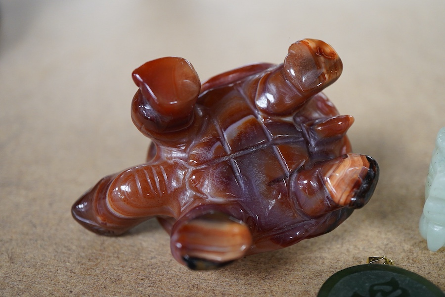 A Chinese carved jade pendant and two hardstone carved animals, pendant 3cm diameter.